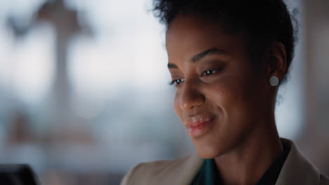 beautiful business woman using tablet computer working late in office browsing information looking at data on digital touchscreen