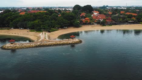 beautiful cinematic sanur beach, bali drone footage with interesting landscape, fishing boats and calm weather