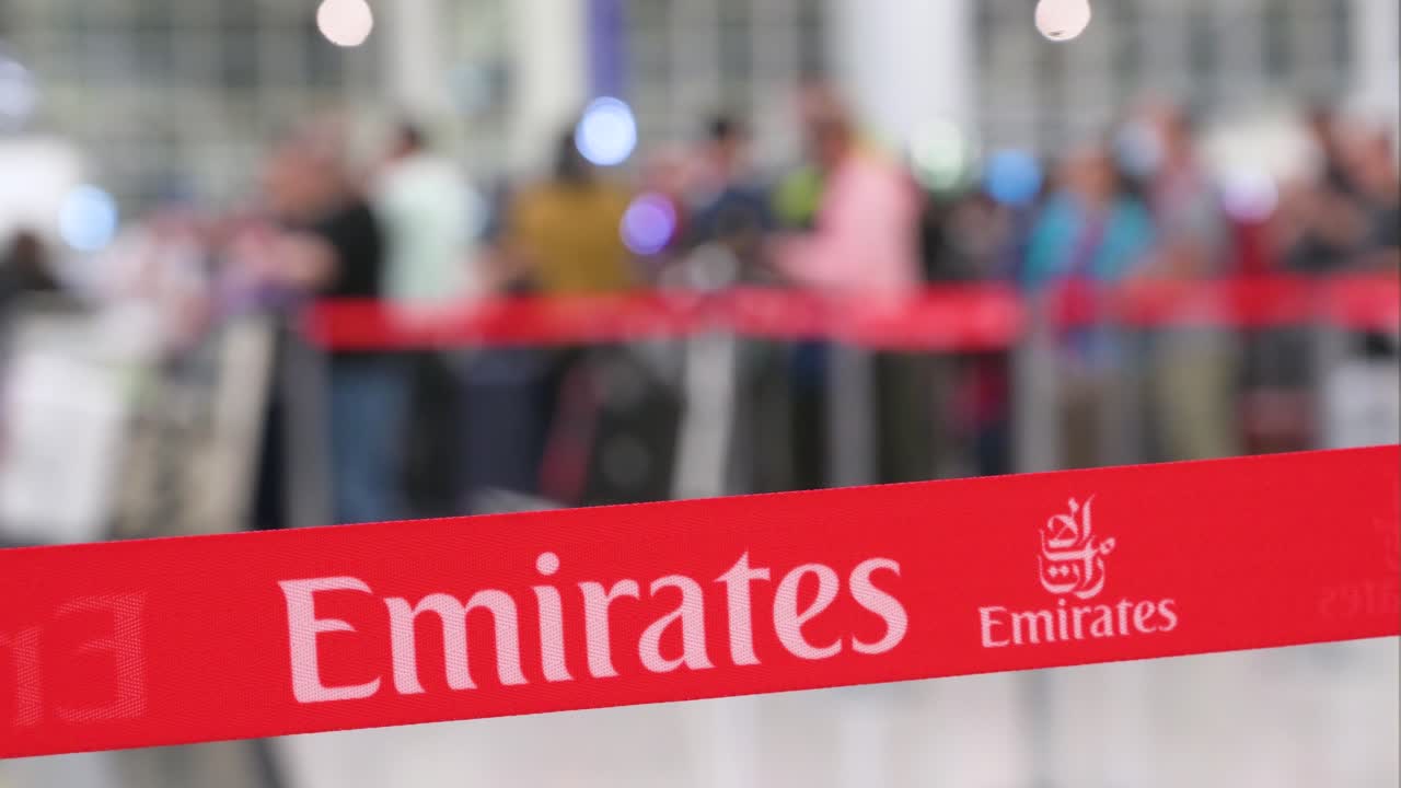 Emirates Airline Passengers Waiting in Queue at Airport