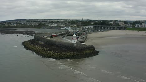 aerial 4k pan-flyover shot of lighthouse, balbriggan lighthouse