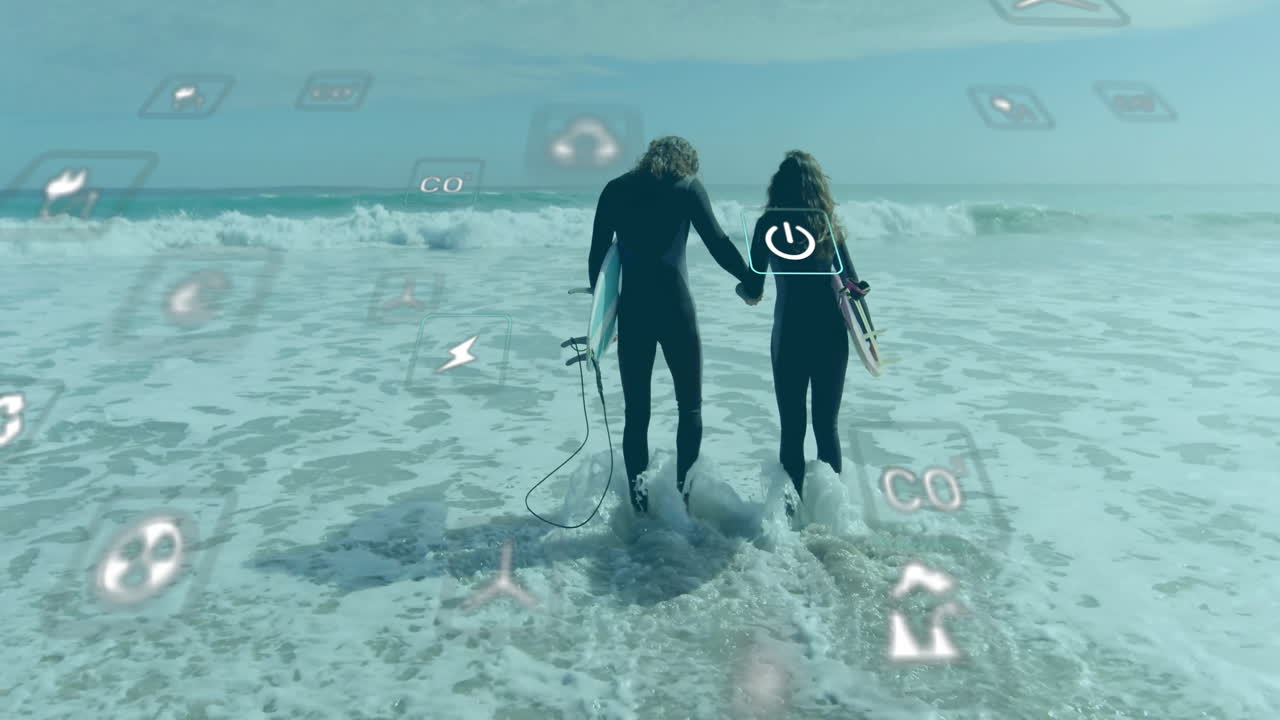 Animation of network of eco icons over happy caucasian couple with surfboards