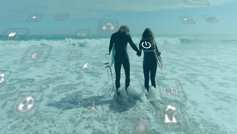 animation of network of eco icons over happy caucasian couple with surfboards