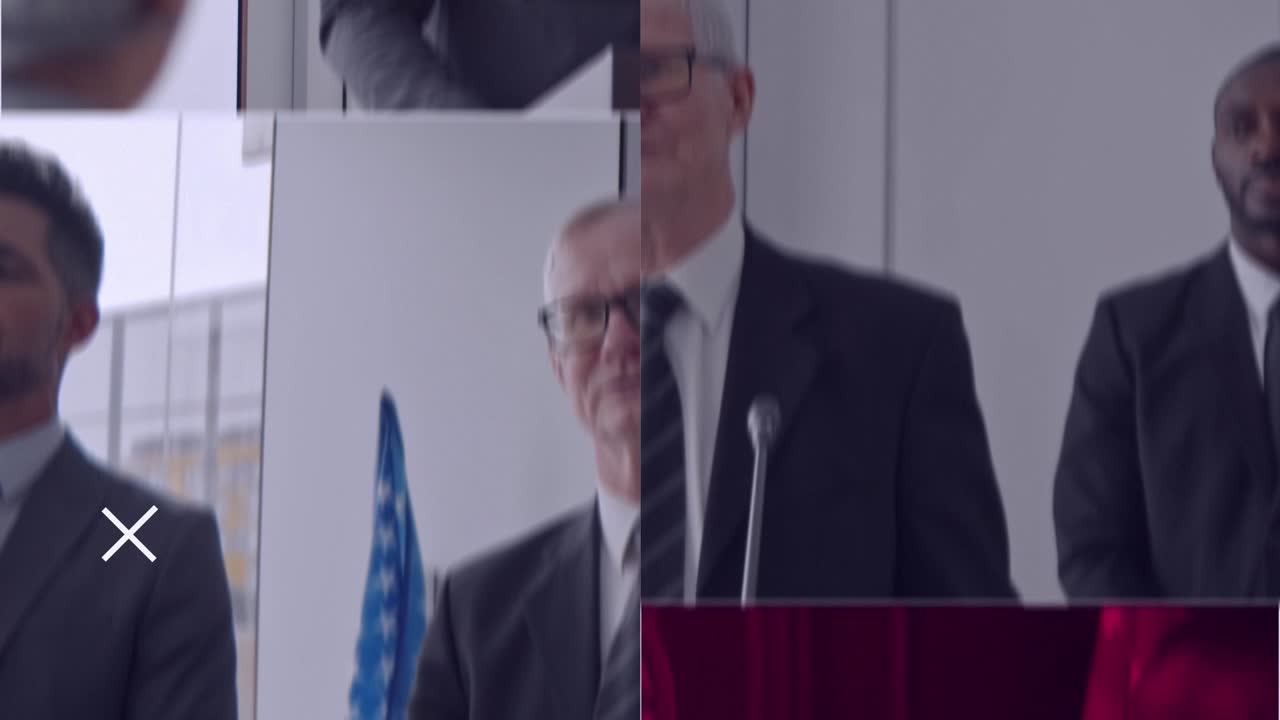 Men in suits at a press conference