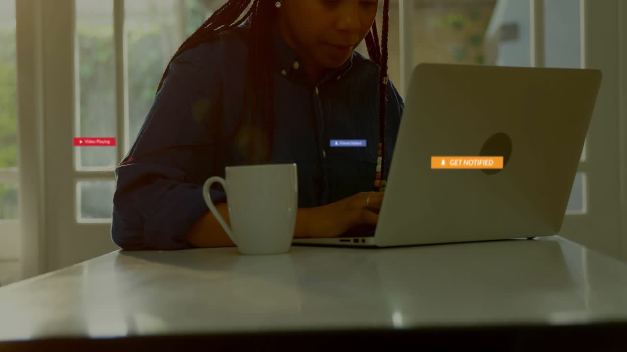 Mid adult woman typing on laptop when tech notifications flooding screen for alert testing