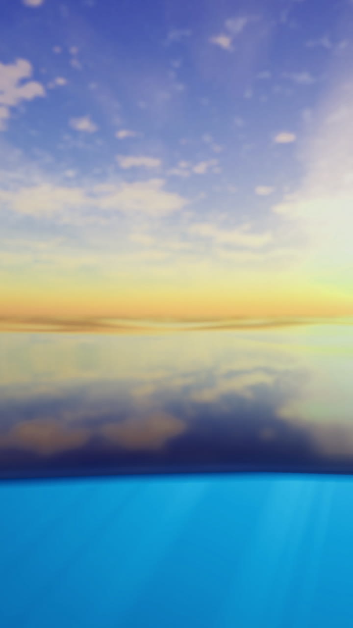 Serene sunset over calm ocean waters with reflection of clouds and sun