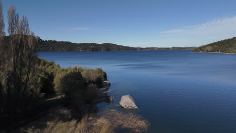 scenic lakeside view with abandoned structure