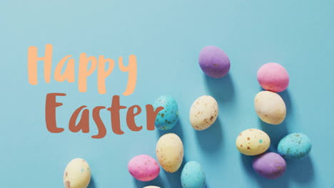 animation of happy easter text over easter eggs