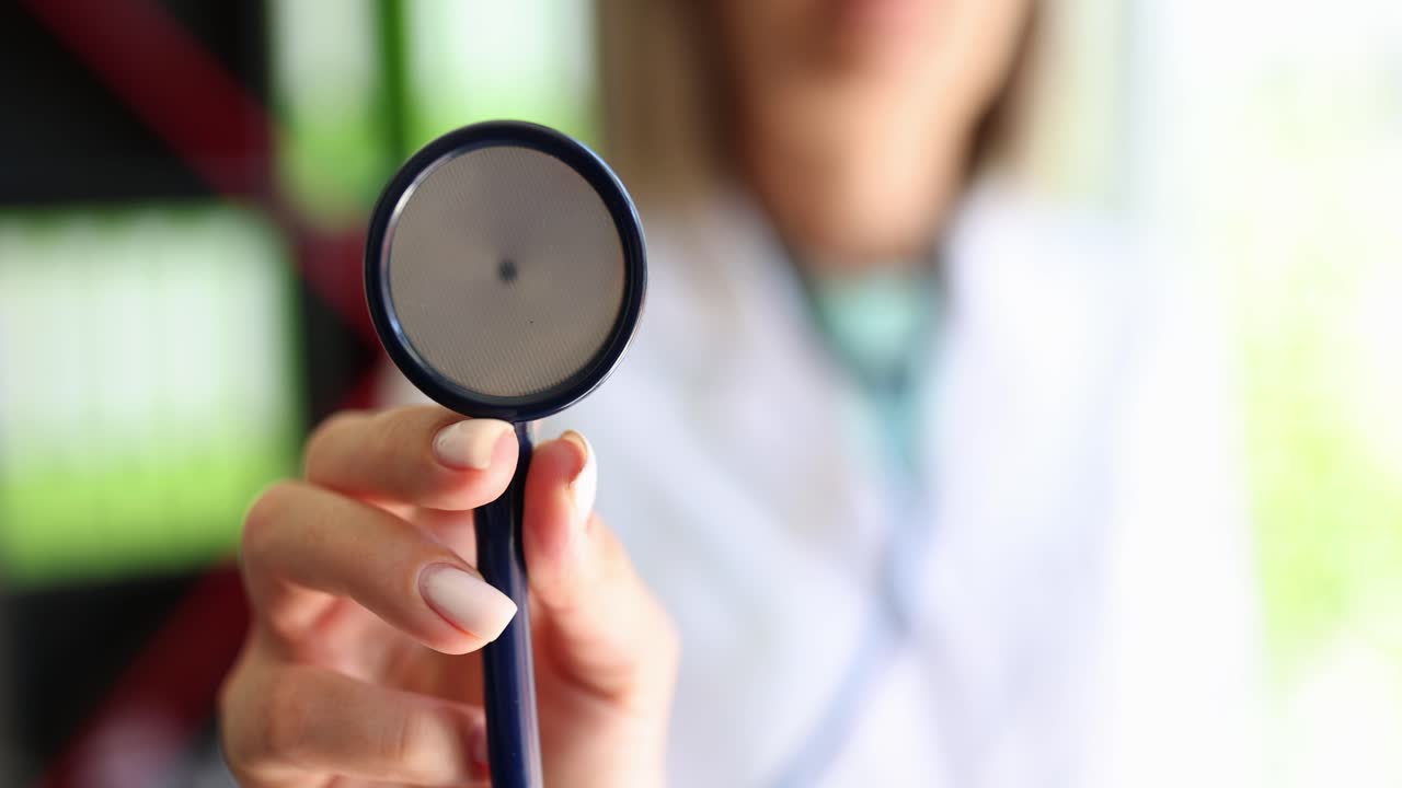 Close-up of a medical professional holding a stethoscope