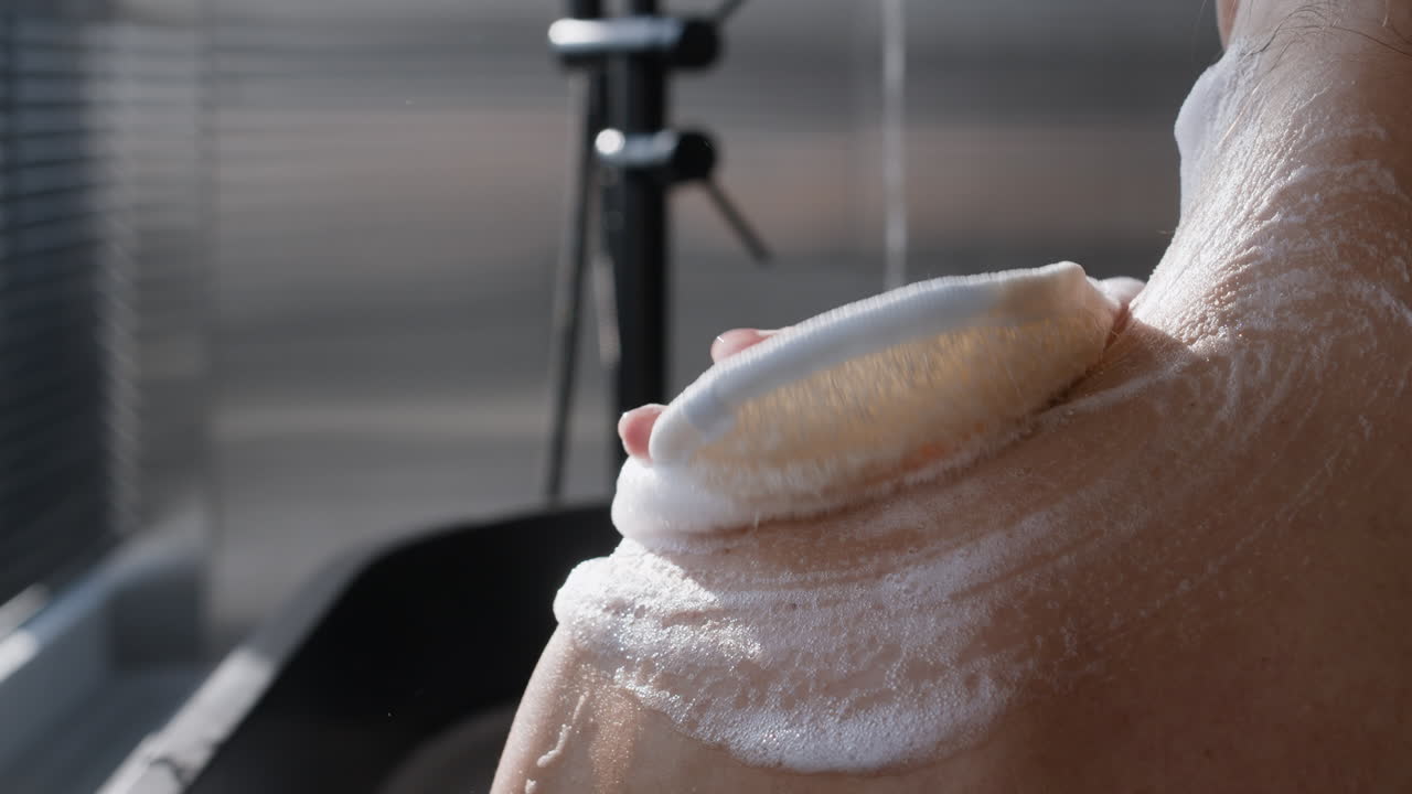 Woman Scrubbing Her Back in the Shower