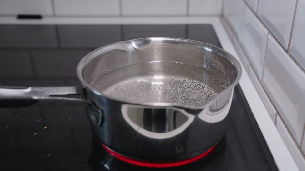 Footage of a pot with water on a stove