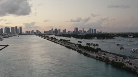 miami skyline at sunset with traffic on the intercoastal highway