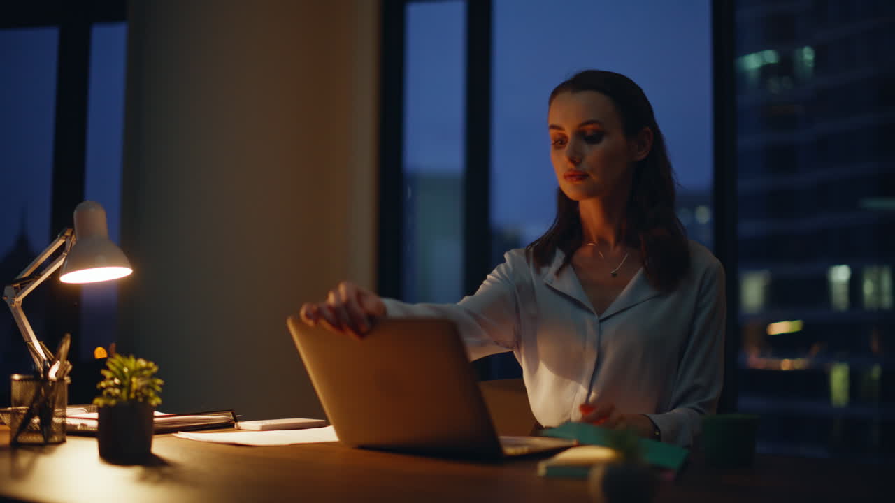 Woman working late at her desk