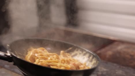 cooking pasta in a pan