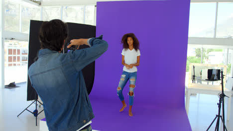 female model posing for a photoshoot in the studio 4k