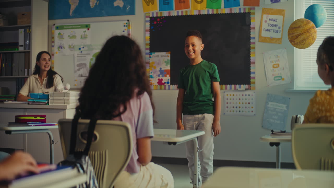 Female Teacher Calling Young Student to the Board During Science Lesson