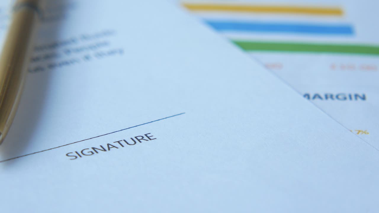 Signature Document with Pen and Charts