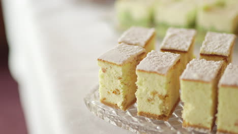 close up of cheesecake with sugar sprinkles on a tray
