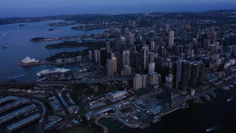 Sydney---Flying-Up-High-with-View-over-Opera-House-and-Circular-Quay