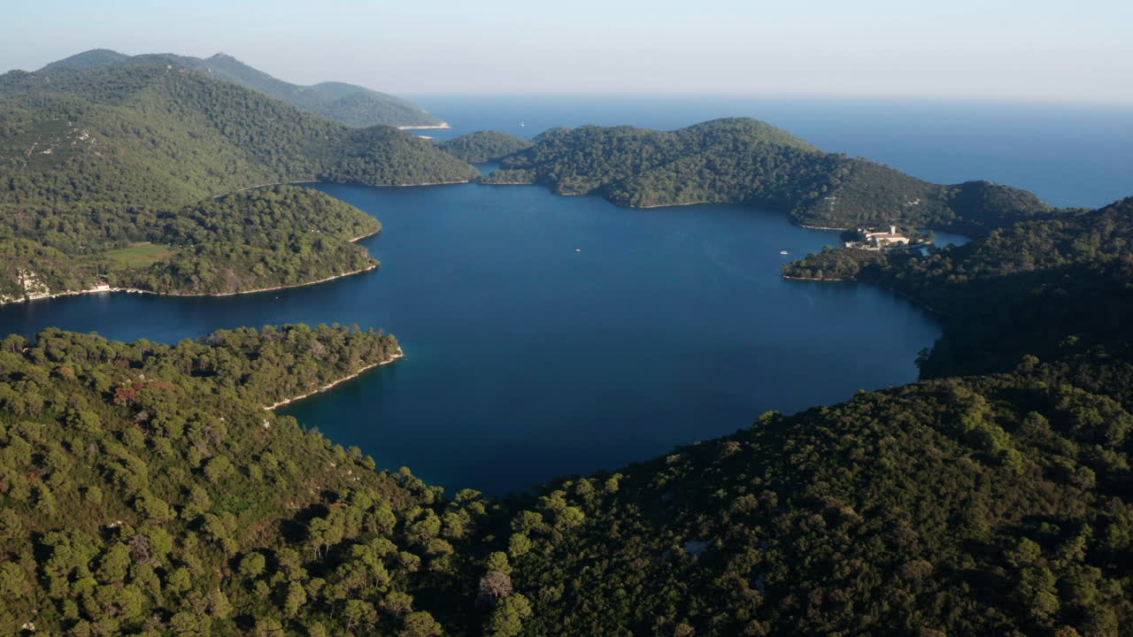 Beautiful forest surrounding a calm lake in the Mljet National Park in Croatia