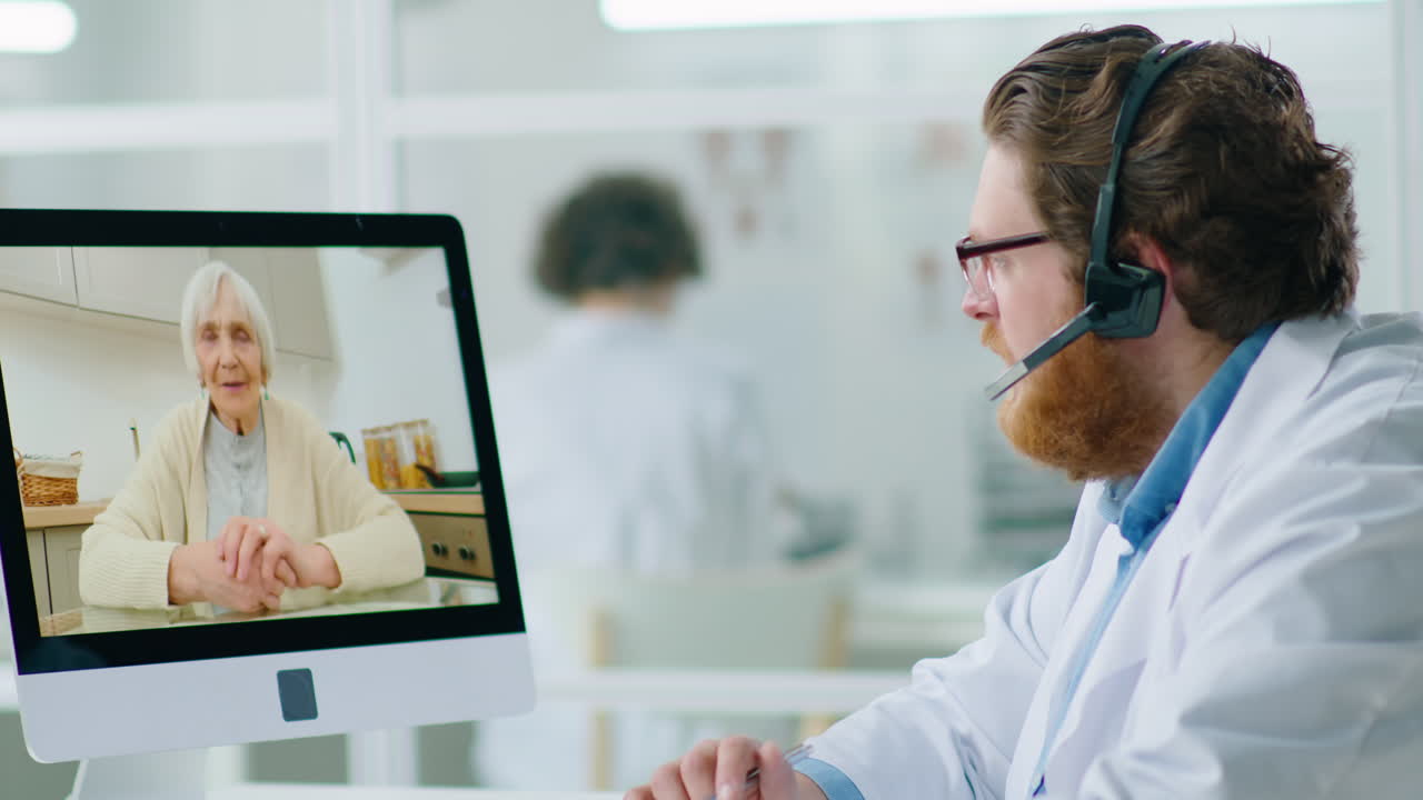 Doctor Consulting Senior Woman via Video Call