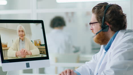 doctor consulting senior woman via video call