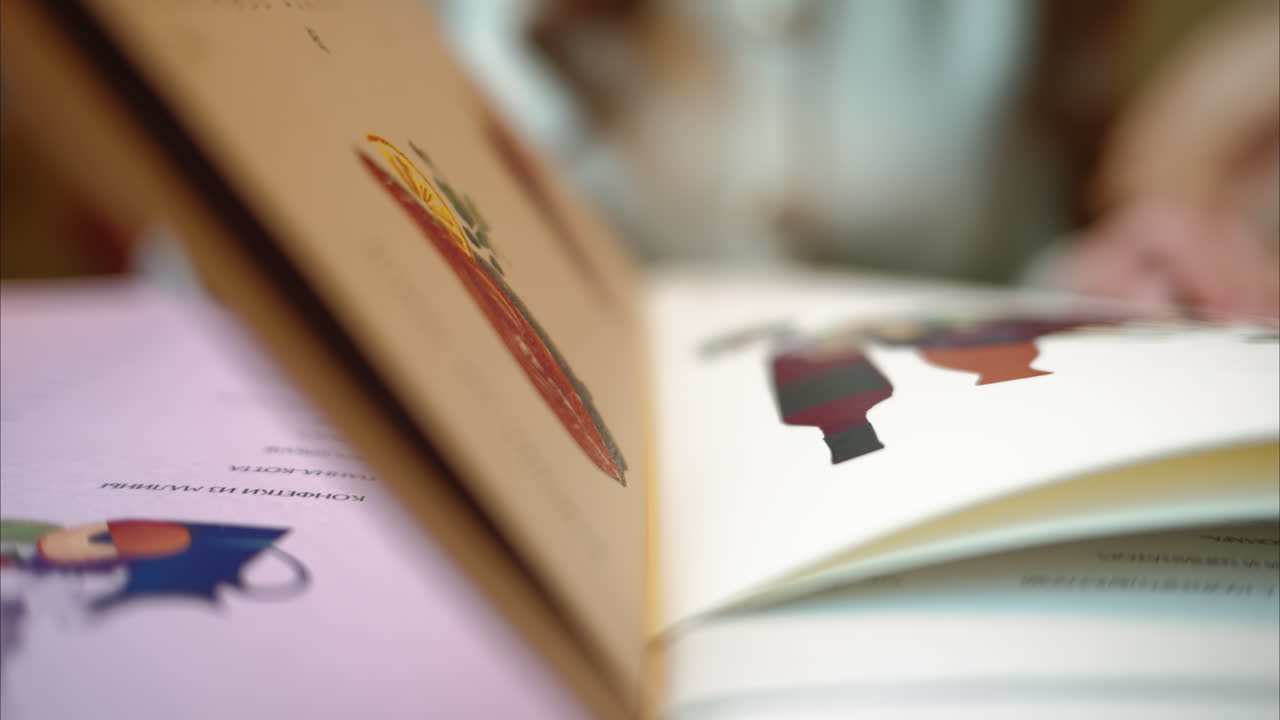 Girl leafing through the menu at a restaurant