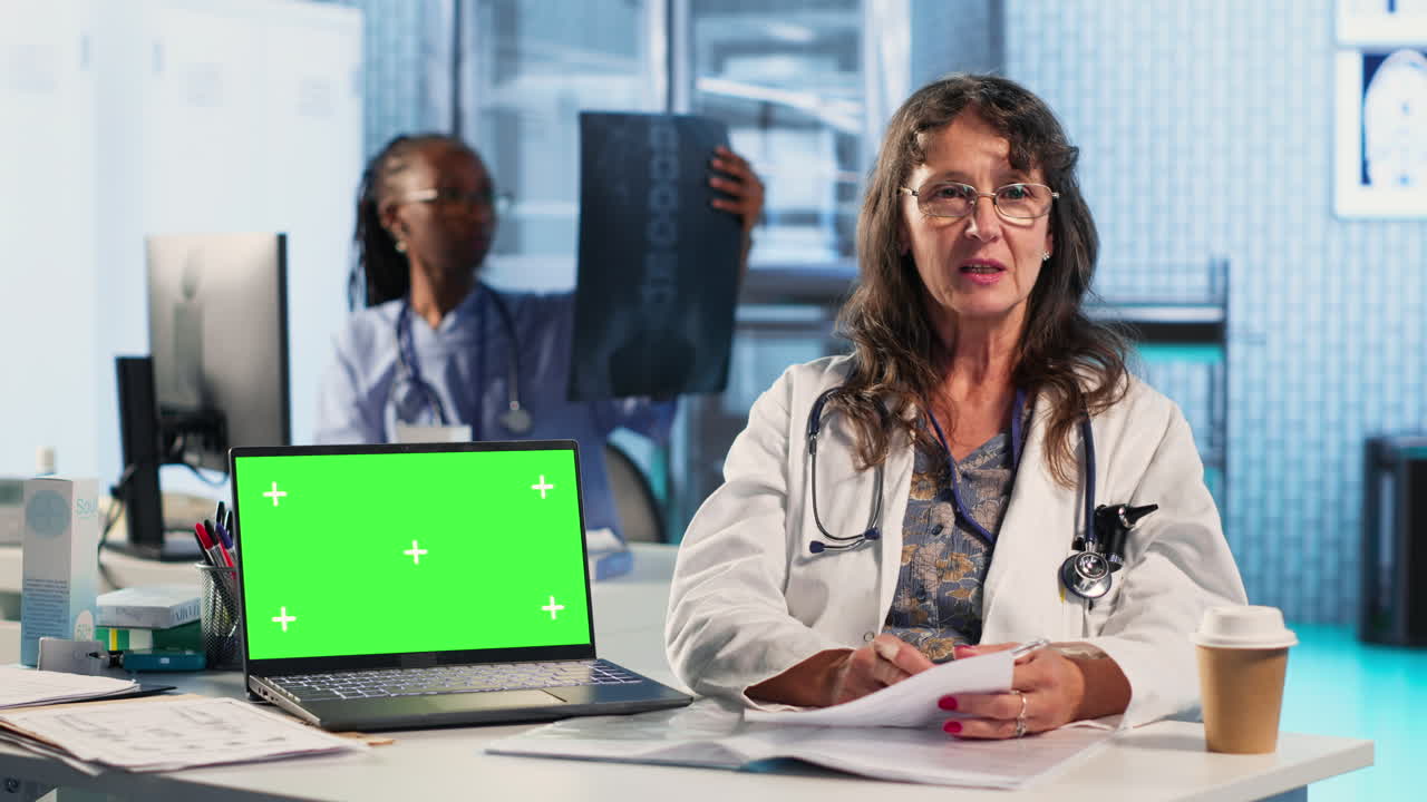 Vertical Video Senior medic consulting ill man in cabinet with isolated mockup screen