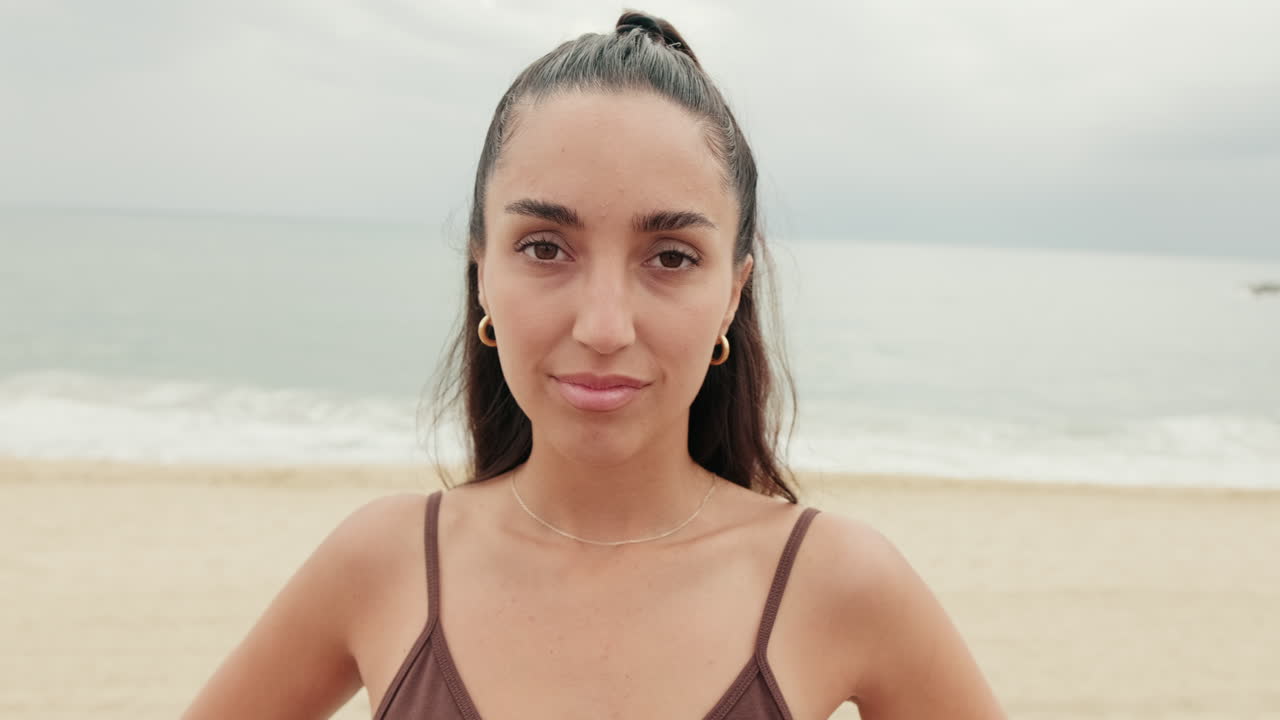 Woman on Beach with Cloudy Sky
