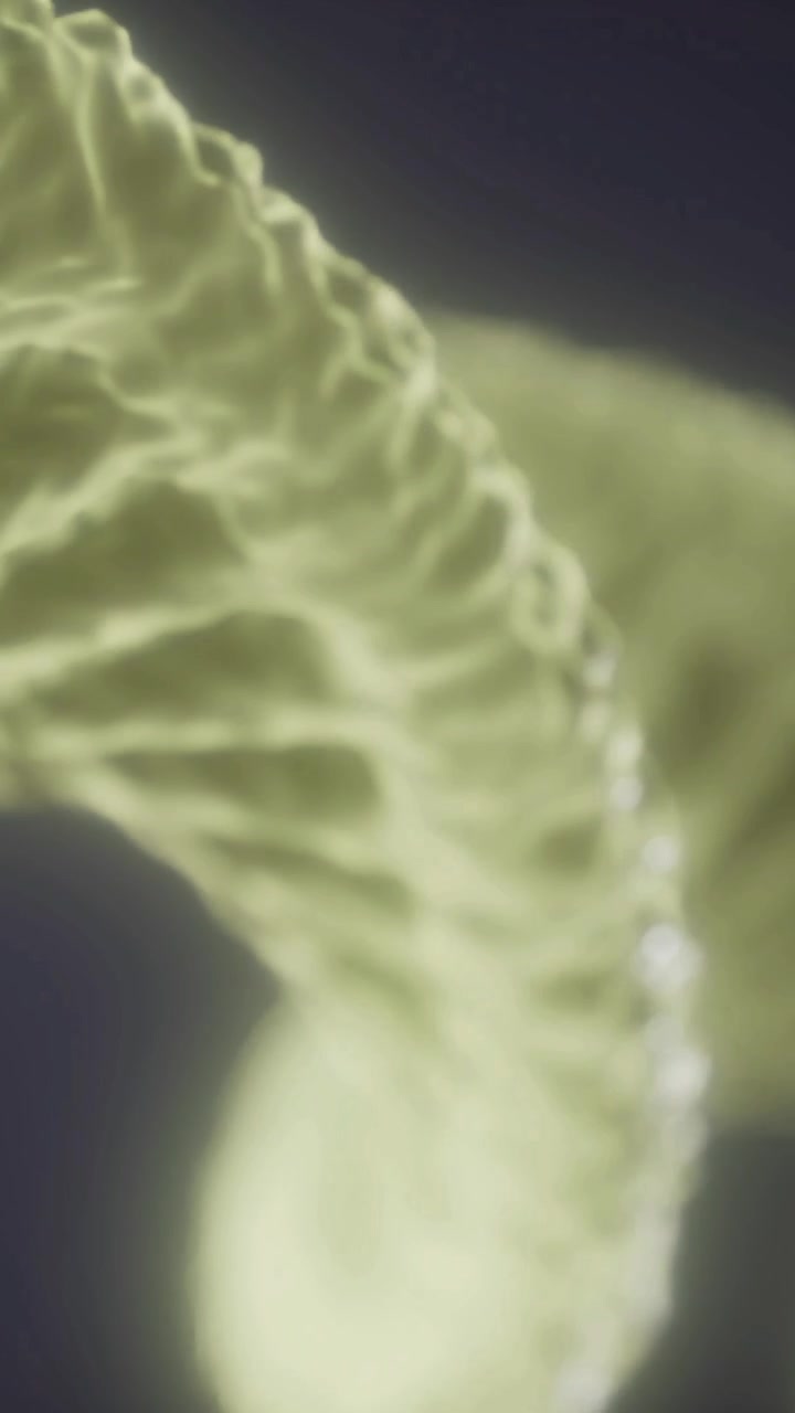 Motivi vorticosi di luce e forma in uno studio scientifico vibrante.