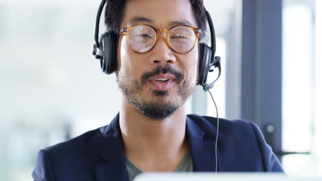 a-handsome-young-businessman-using-a-headset