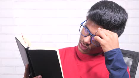 young man reading, concentrating