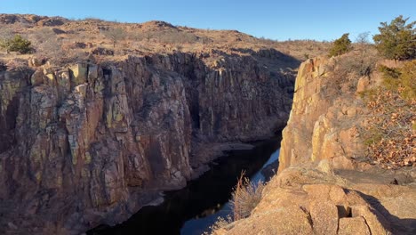 wasteland river flowing between deep ravine canyons in rural oklahoma