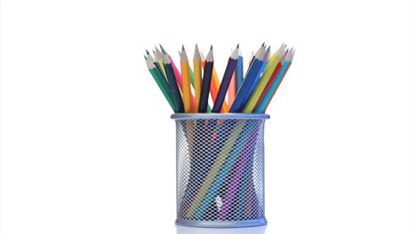 color pencils rotating in a pencil holder