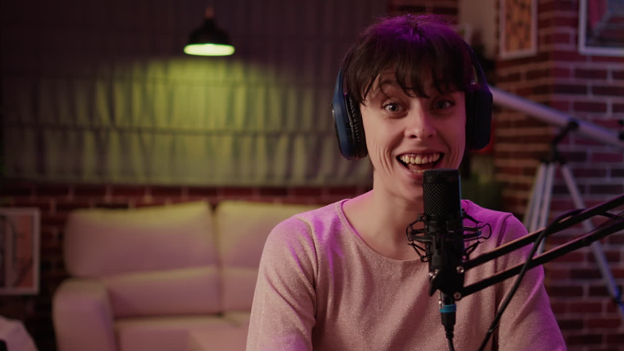 Portrait of woman broadcasting internet radio entartainment show using professional microphone