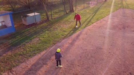 children playing soccer on a field