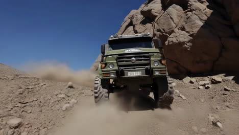 off-road truck climbing rocky mountain terrain