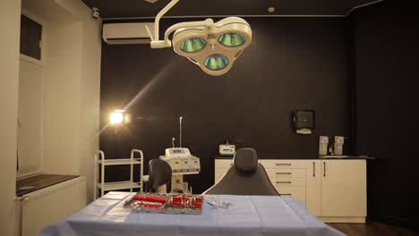 a dental operating room with equipment and chair