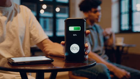 smartphone charging in a cafe