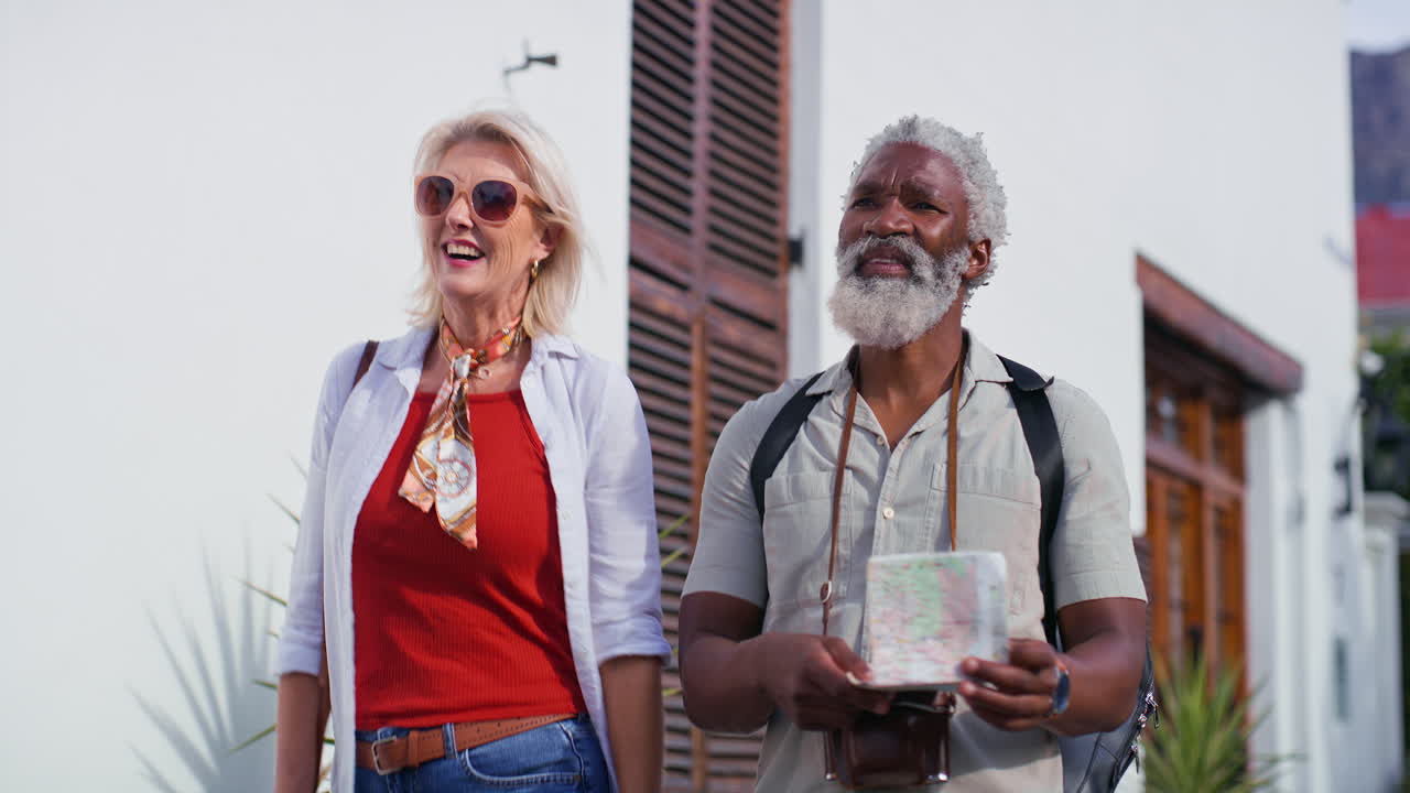 Senior couple exploring with a map