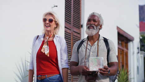 senior couple exploring with a map