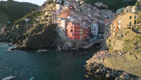 Cinematic-Aerial-View-of-Riomaggiore-in-Cinque-Terre,-Italy-at-Sunset