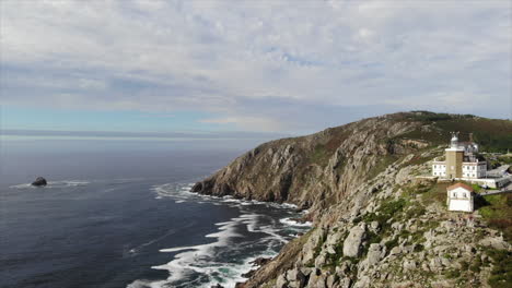 aerial shot of the fisterra lighthouse in galicia.