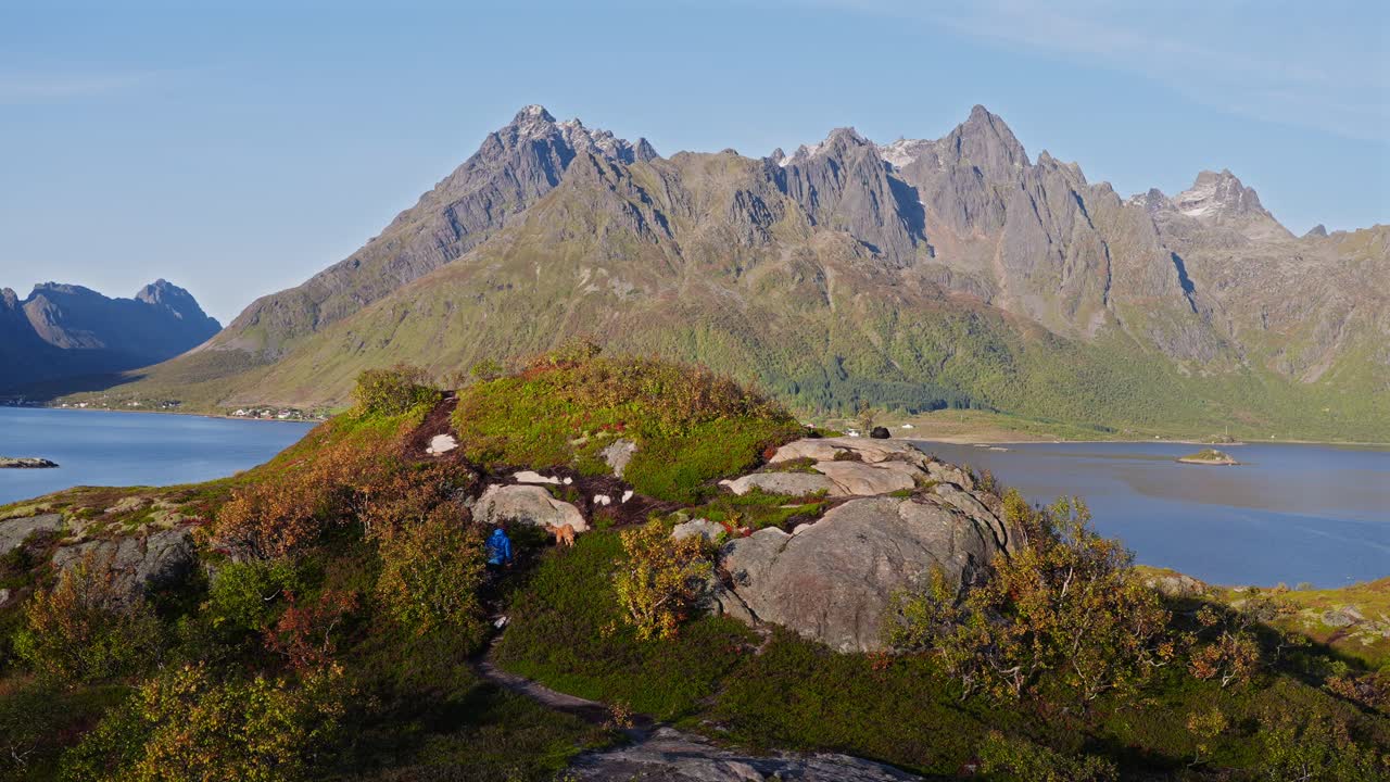 A stunning mountain landscape in Vesterålen with vibrant greenery and blue skies