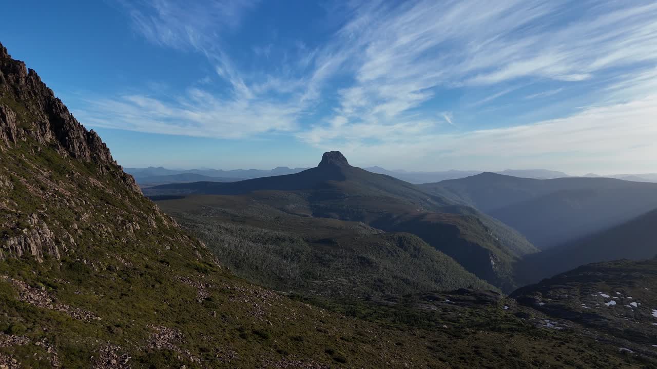Barn Bluff Mount seen from Cradle Mountain, National Park in Central Highlands, Tasmania, Australia. Aerial forward