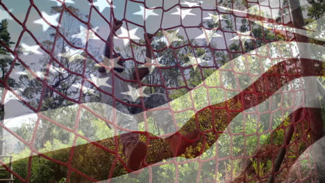 animación de la bandera de los estados unidos sobre un hombre afroamericano durante el entrenamiento de carrera de obstáculos