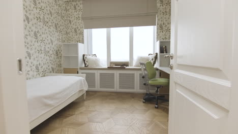 modern child's bedroom with built-in desk and window seat