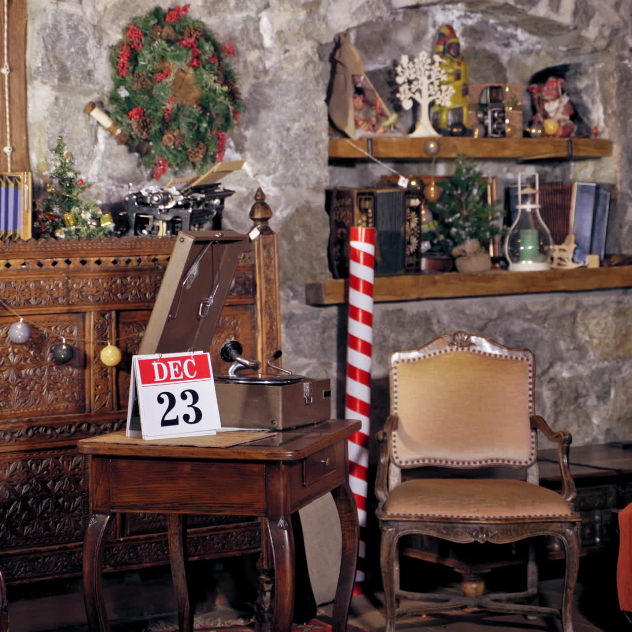 Santa changes the calendar page into 24th of December. Christmas decorated room and Santa flipping the calendar on a wooden table.