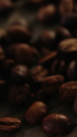 disposable cup with coffee beans on wooden plank