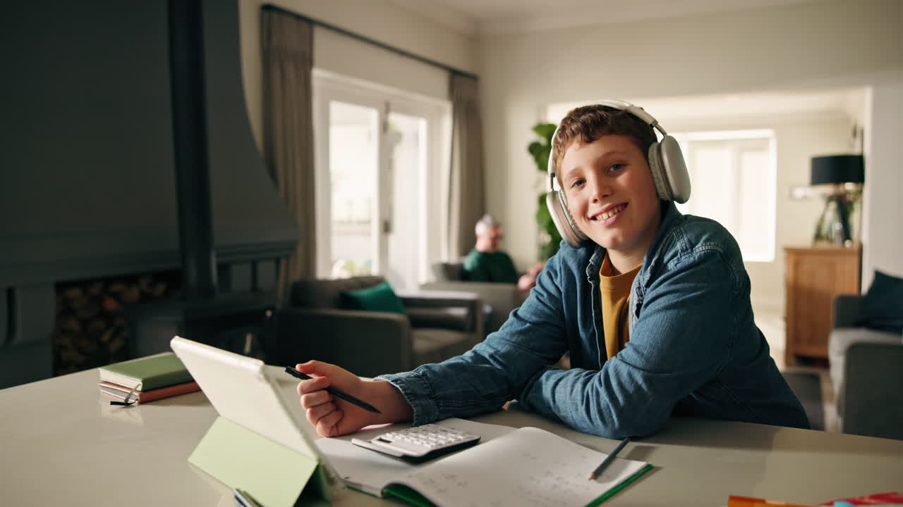 Boy Learning at Home with Tablet and Headphones