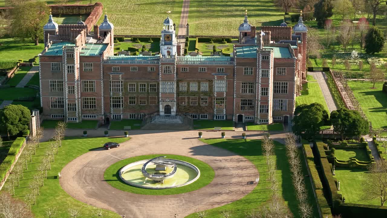 Aerial view over Hatfield country house courtyard with fountain and landscaped estate gardens